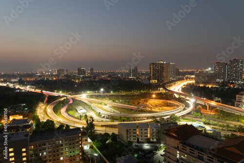 Aerial view of highway street road at Bangkok Downtown Skyline, Thailand. Financial district and business centers in smart urban city in Asia.Skyscraper and high-rise buildings at night