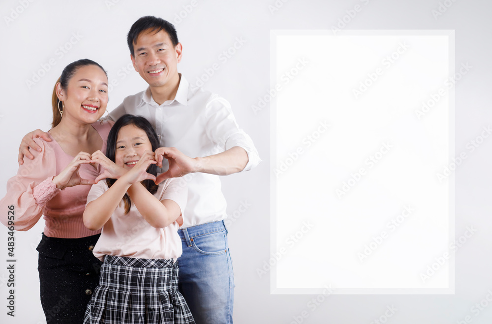 Happy Asian family Woman and a Man with junior girl smiling and fun in the white background, Lovely family, save with Clipping path only White frame. Happy Asian family Woman and a Man with junior girl smiling and fun in the white background, Lovely family, save with Clipping path only White frame.