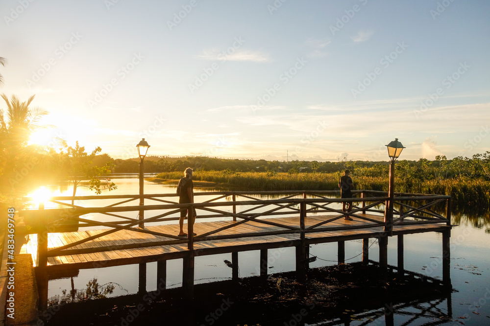 wooden pier on a lake at sunset wooden pier on a lake at sunset