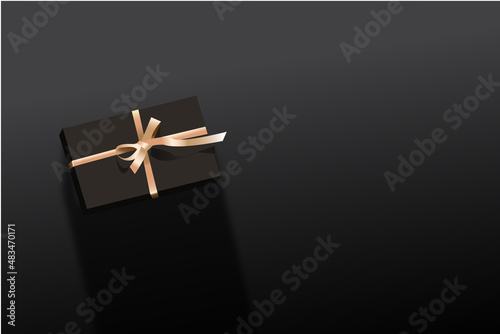 gift in mat black color. Birthday gifts and any holiday gifts, decorations on a black background. Flat lay, top view with light 