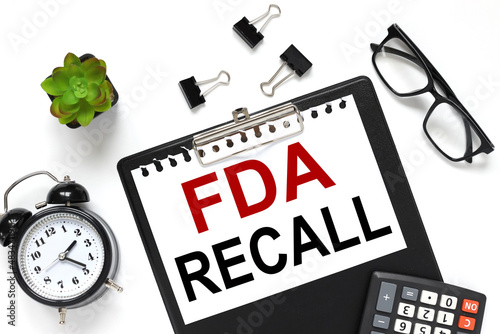 FDA recall text on white paper on folder