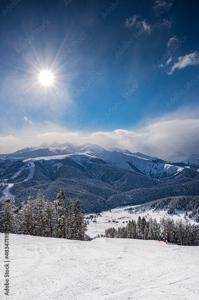 Beautiful landscape winter summer day on mountain in ski resort Arkhyz, Caucasus mountains, Russia. Vertical orientation