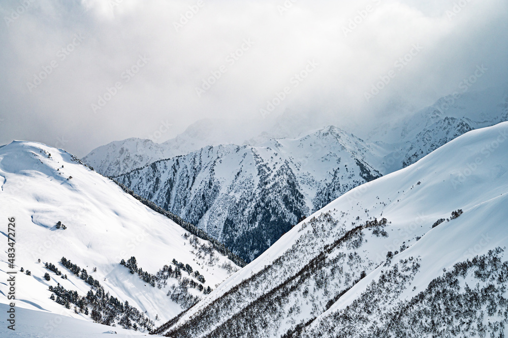 Beautiful landscape winter summer day on snowy mountain in ski resort Arkhyz, Caucasus mountains, Russia