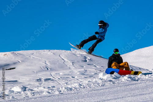 Snowboarders on a slope of the alps