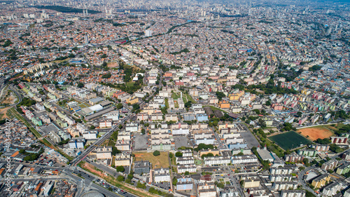 Aerial view of Itaquera, Sao Paulo. Residential buildings, avenues and train