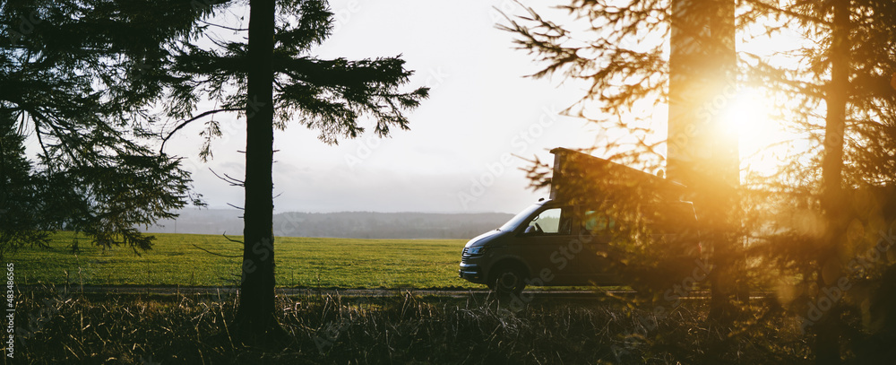 Modern Camping Van parking at the forest in beautiful, authentic nature