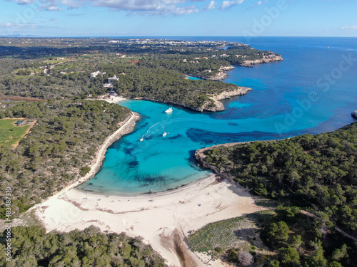 Panoramic photo of the beach in Mallorca. Beautiful view of the seacoast of Mallorca with an amazing turquoise sea, in the middle of the nature. Concept of summer, travel, relax and enjoy. 