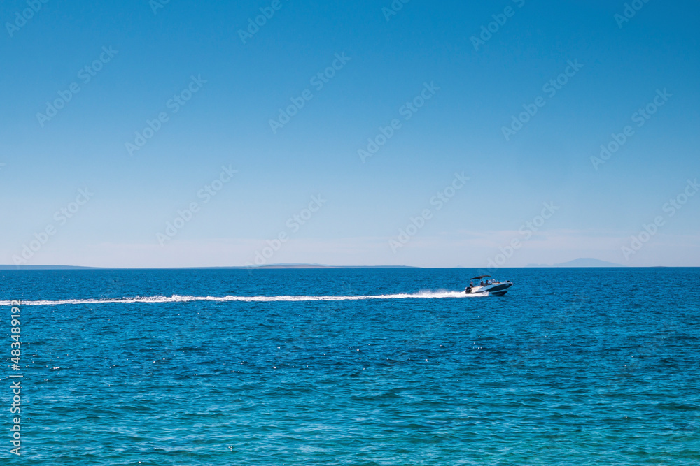 High speed boat on a clear, blue, sea