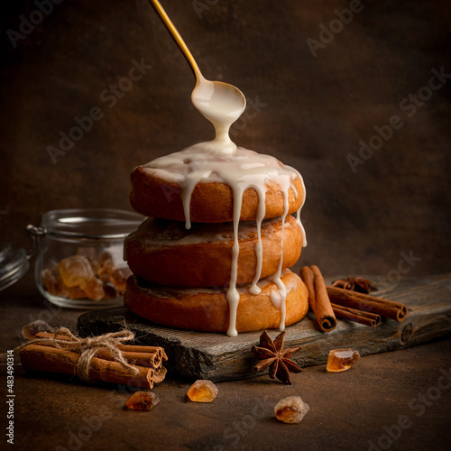 Homemade freshly baked cinnamon rolls covered with icing sugar