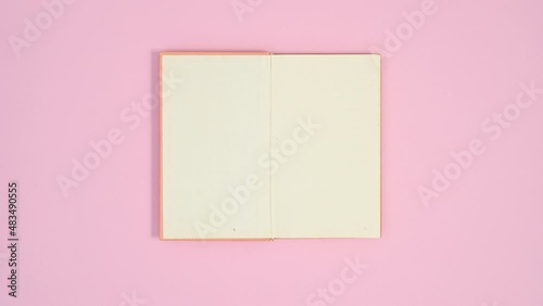 Wallpaper Mural Red heart balloon fly and carry orange book that opens for text. Stop motion flat lay Torontodigital.ca