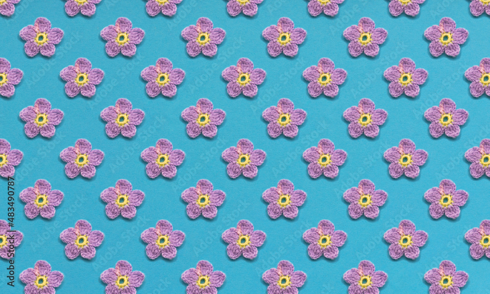 Pattern of purple flowers and one butterfly. Blue or turquoise background