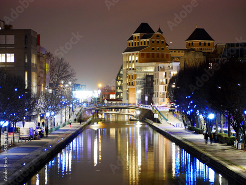 a canal bathed in lights