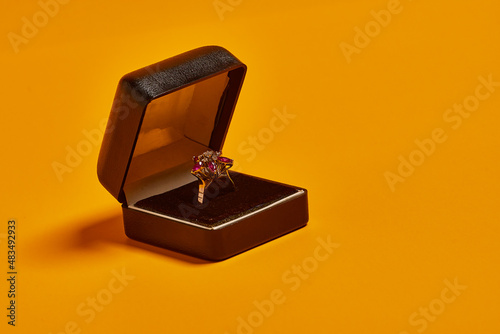 Luxurious jewelry on yellow background. watch, rings, gold necklaces.