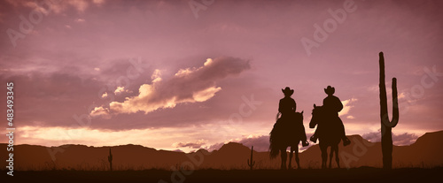 Silhouette of a couple of Cowboys (him and her) at sunset