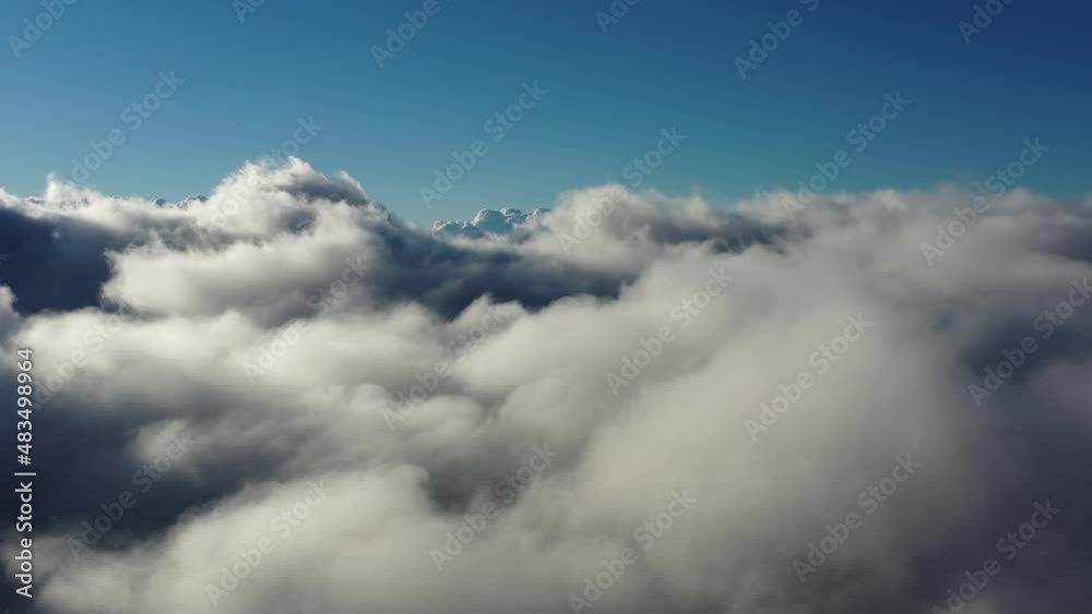 Flying above the clouds. Aerial view of clouds at sunrise. Traveling by air perfect background, 4k Flying above the clouds. Aerial view of clouds at sunrise. Traveling by air perfect background, 4k