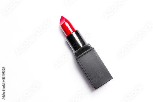 Red lipstick tube on  white background. Beauty industry concept