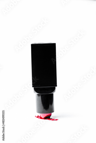 Red lipstick draw on a white background. The concept of the beauty industry, upside down