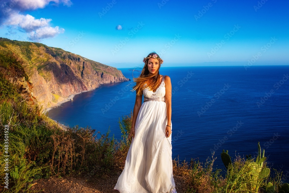 woman in a wedding dress in the mounatins from madeira portugal woman in a wedding dress in the mounatins from madeira portugal