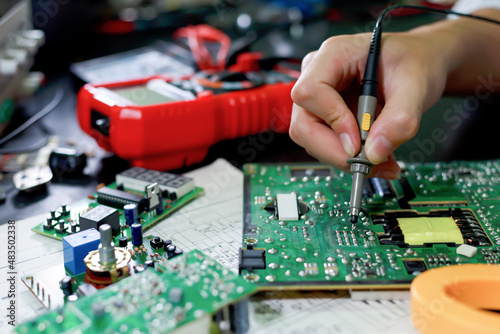 Electronics technician, electronics measuring and testing, repair and maintenance concepts. photo