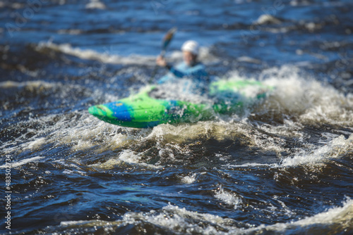 Kayak slalom canoe race in white water rapid river, process of kayaking competition with colorful canoe kayak boat paddling, process of canoeing with big water splash