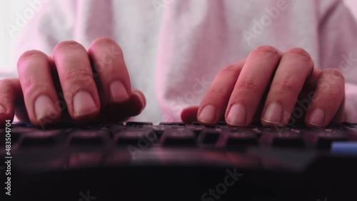 The man quickly typing on a computer keyboard. High quality 4k footage