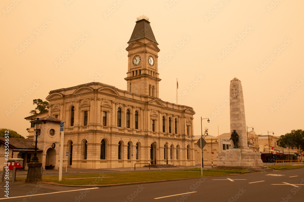 Waitaki District Council building and War Memorial, Oamaru. The sky is cast in an eerie light due to the effect of Austrailian bush fires in Jan 2020