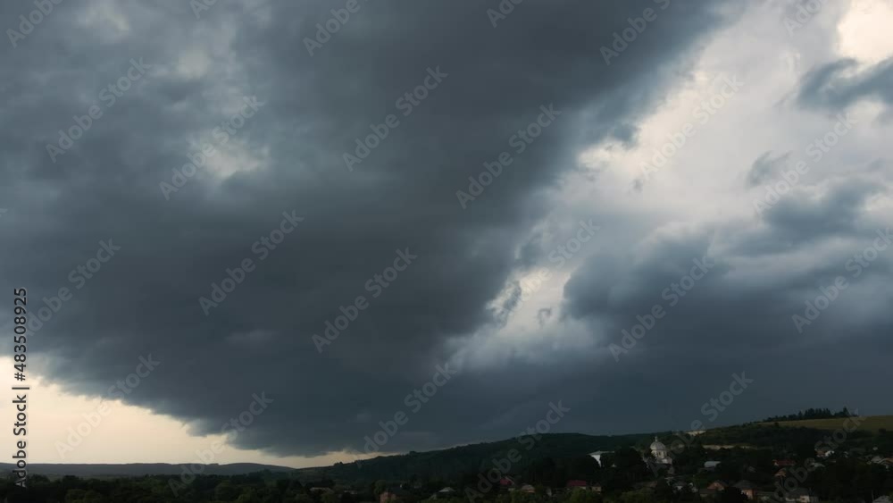 Landscape of dark clouds forming on stormy sky during thunderstorm over rural area Landscape of dark clouds forming on stormy sky during thunderstorm over rural area