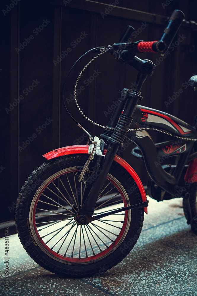 Fototapeta premium Red kids bicycle in garage 1