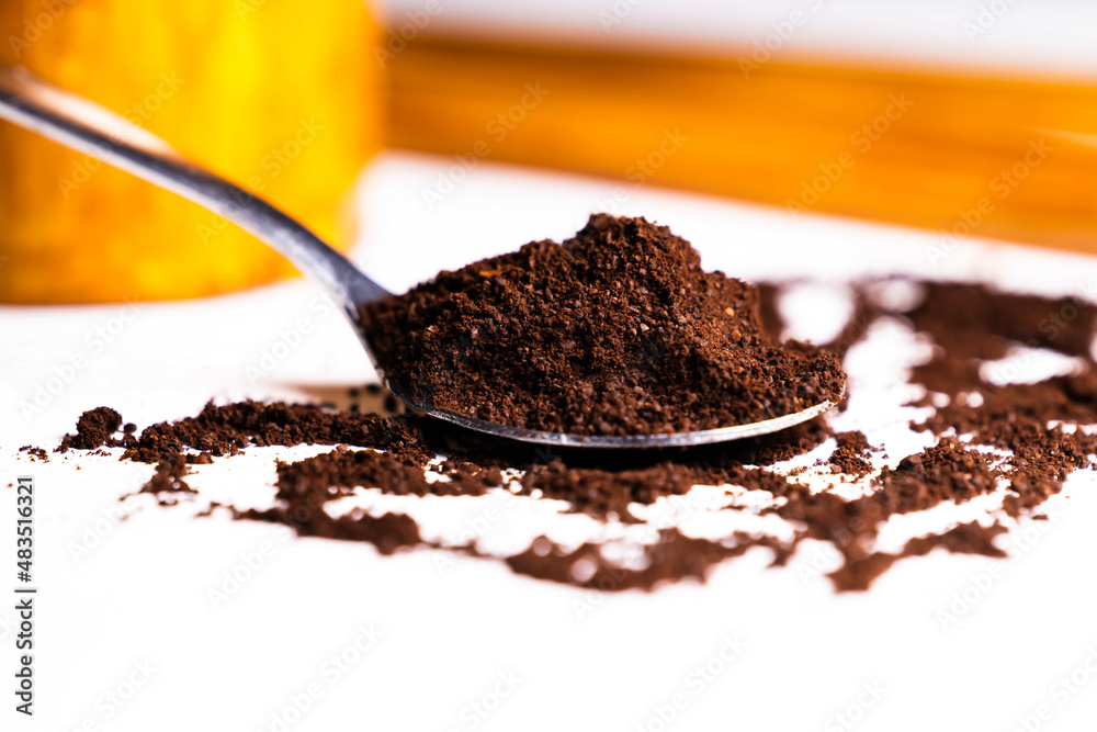 Selective focus and close up image of a spoon of ground coffee powder Selective focus and close up image of a spoon of ground coffee powder