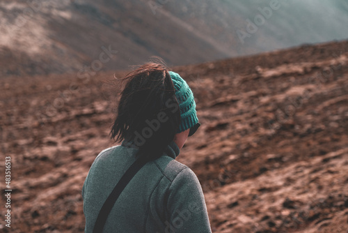 Woman in Green Beanie Hiking in Iceland