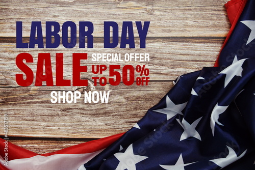 Labor Day Sale message with American flag on wooden background