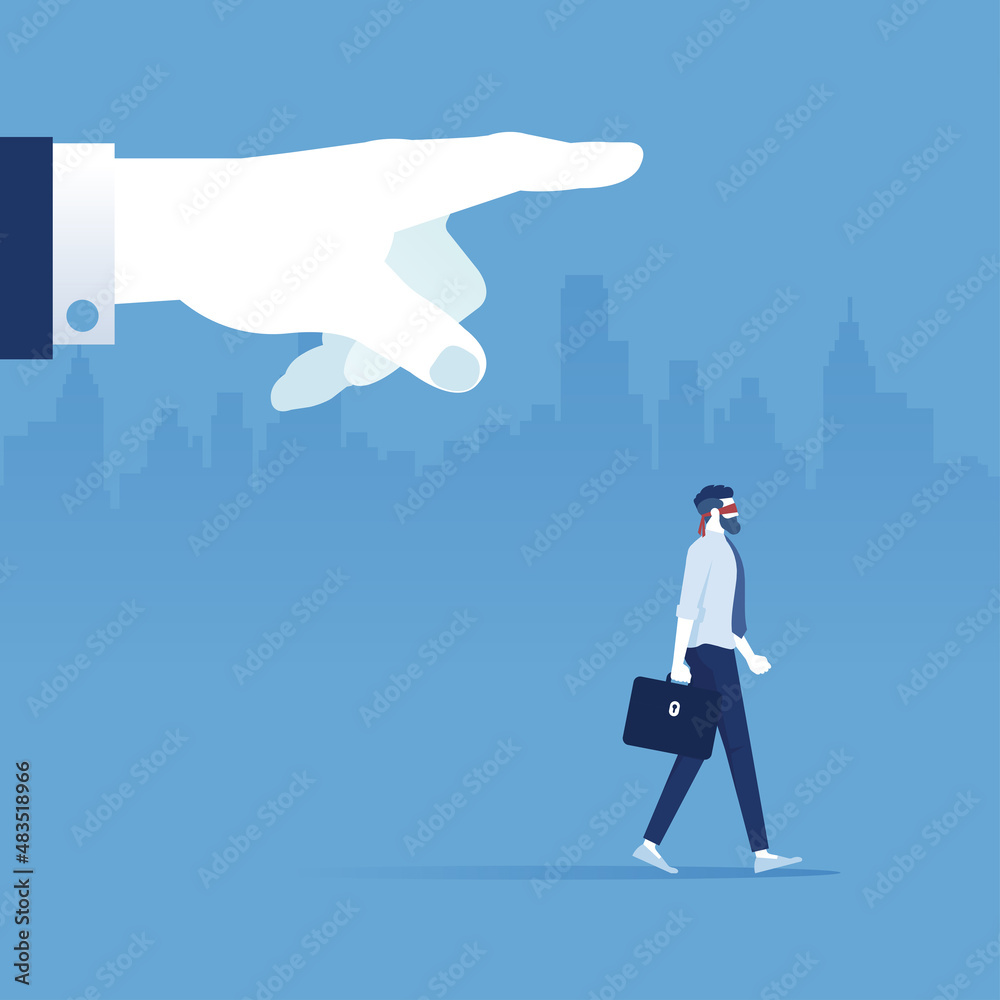 Obraz premium Big hand controlling blindfolded businessman walk forward, business control or puppet