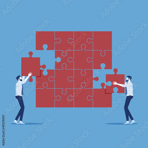 Businessman help each other to assemble jigsaw, teamwork and success concept