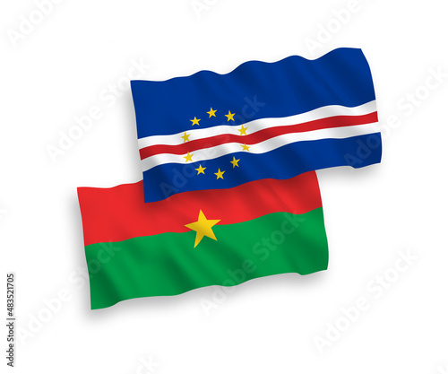 National vector fabric wave flags of Republic of Cabo Verde and Burkina Faso isolated on white background. 1 to 2 proportion.