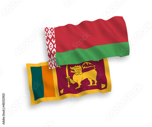 National vector fabric wave flags of Sri Lanka and Belarus isolated on white background. 1 to 2 proportion.