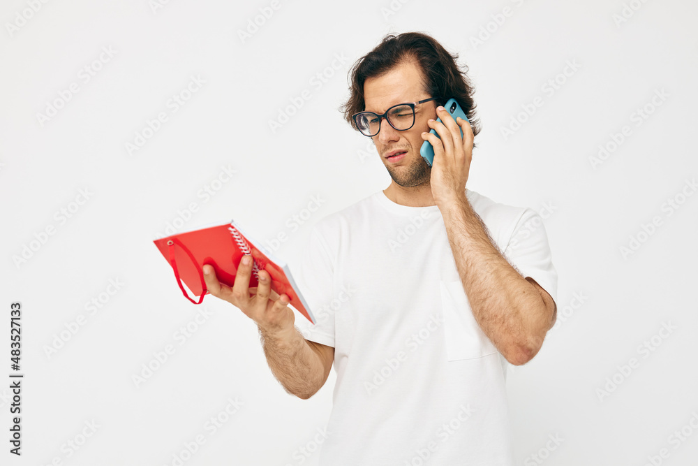 handsome man red notepad telephone communication Lifestyle unaltered handsome man red notepad telephone communication Lifestyle unaltered