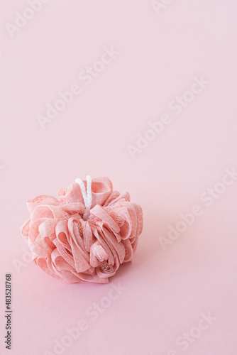 Spa, bath, wellness, skincare concept with sponge on pink background