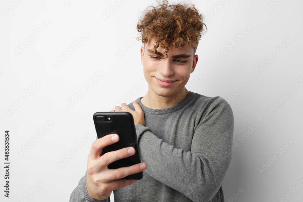 handsome guy looking at the phone fashion Lifestyle unaltered handsome guy looking at the phone fashion Lifestyle unaltered