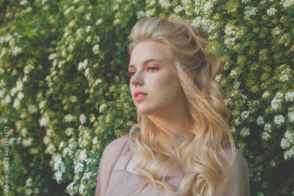 Fashion outdoor photo of pretty woman with blond hair at summer garden Fashion outdoor photo of pretty woman with blond hair at summer garden
