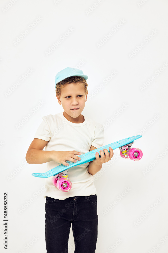 Little boy skateboard in hands posing lifestyle childhood Little boy skateboard in hands posing lifestyle childhood