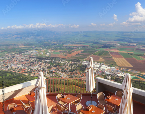 Cafe overlooking the Hula valley. Kiryat Shmona city and beautiful farming landscape with agricultural land. Upper Galilee. Northern Israel photo