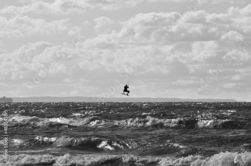 kitesurfing action  at baltic sea in black end white
