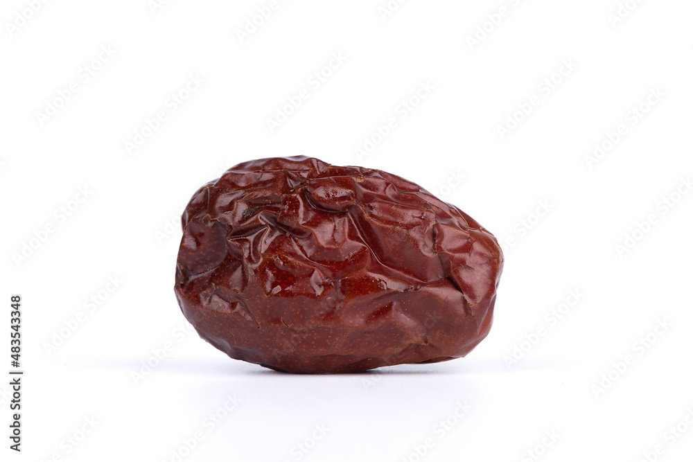 Close-up of a dried date on a white background. Close-up of a dried date on a white background.