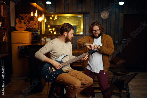 Guitar training music lesson at professional studio