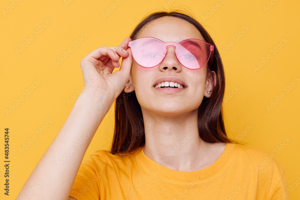 attractive woman fashion in yellow t-shirt denim shorts yellow background attractive woman fashion in yellow t-shirt denim shorts yellow background