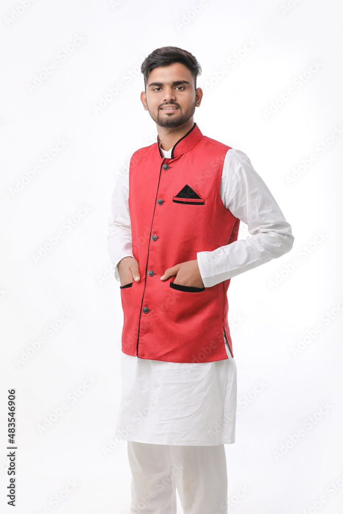 Young indian man in traditional wear and giving expression on white background.