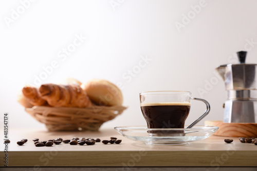 Coffee for breakfast on bench with pastries isolated background