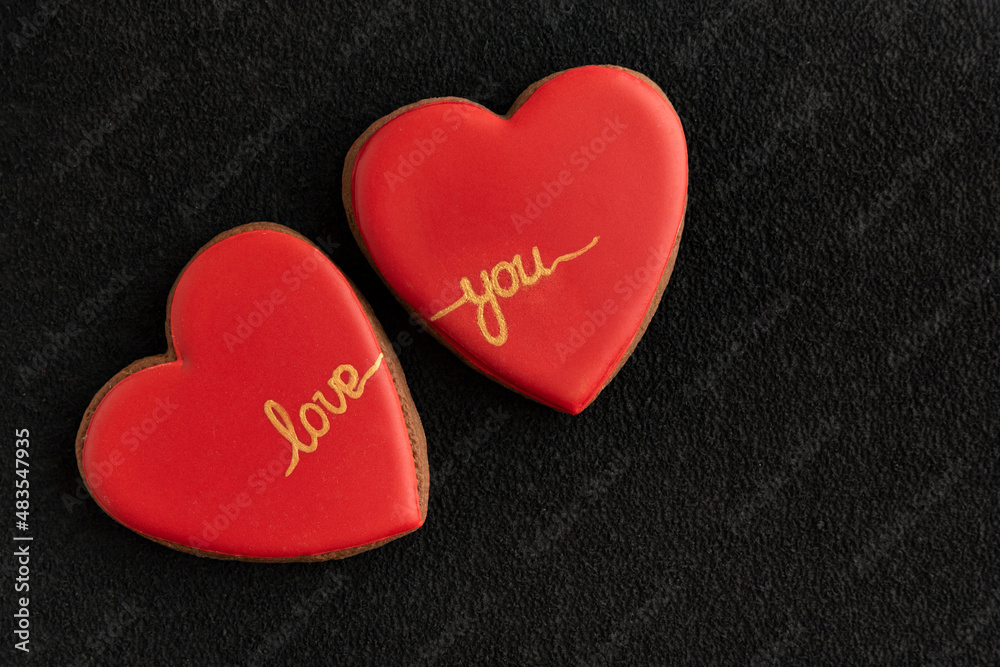 Red homemade cookies shape of hearts. Valentine's Day, inscription love you Red homemade cookies shape of hearts. Valentine's Day, inscription love you