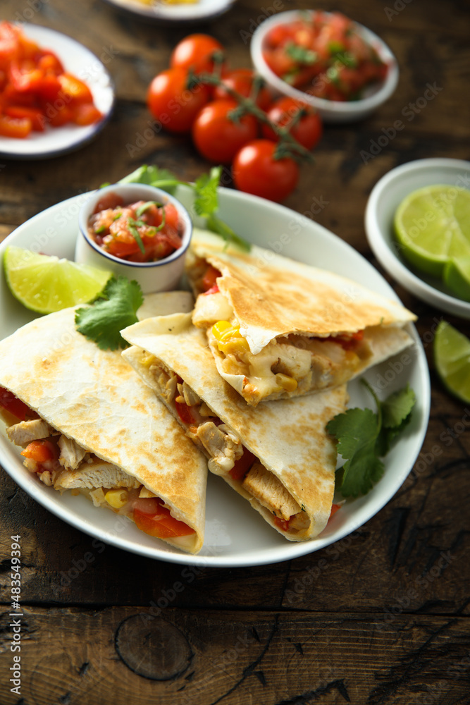 Homemade quesadilla with chicken and tomatoes Homemade quesadilla with chicken and tomatoes