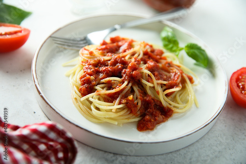 Spaghetti with homemade tomato sauce and basil